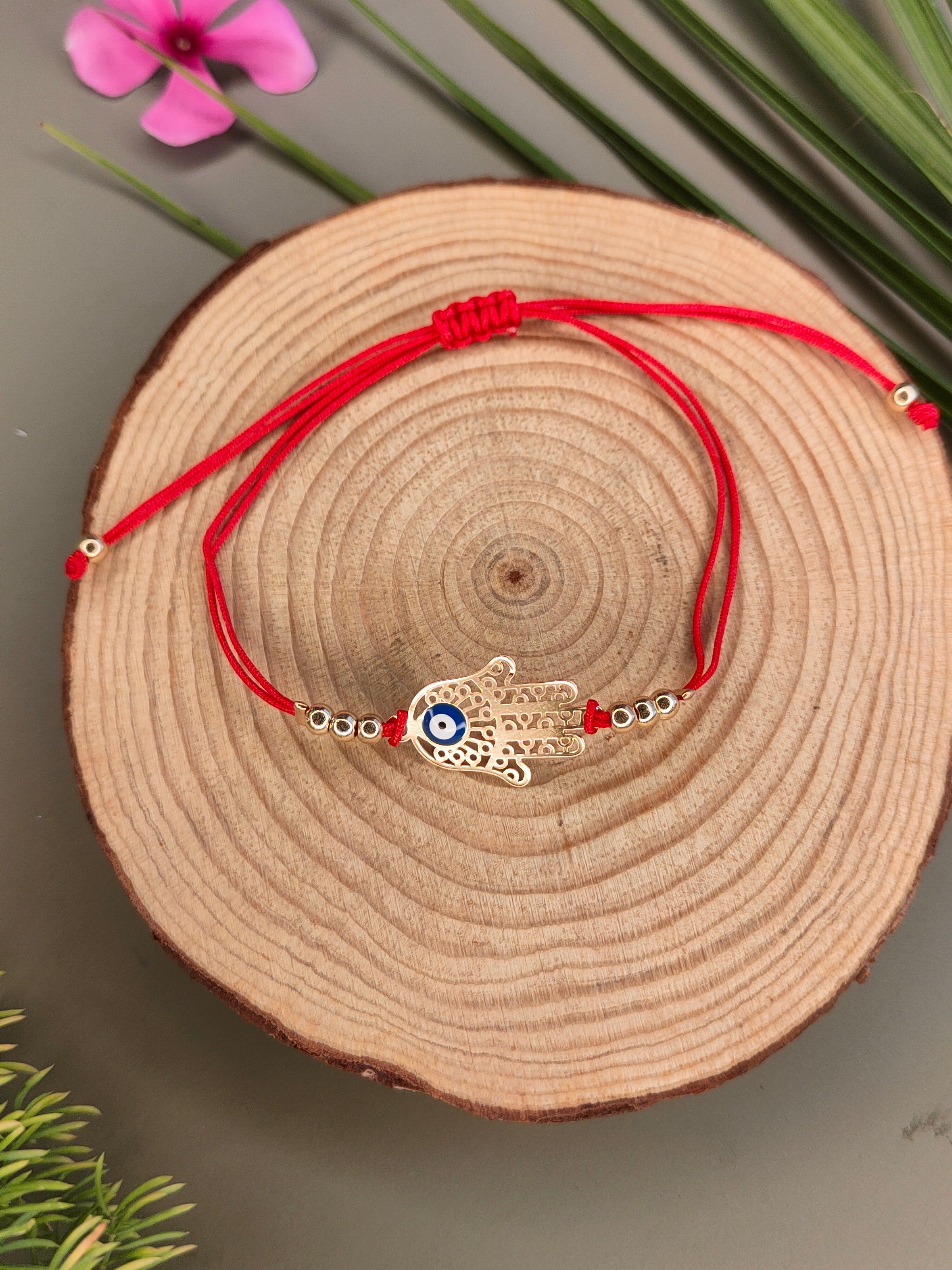 Evil Eye Woven Elegant Rakhi in Blessing Hands