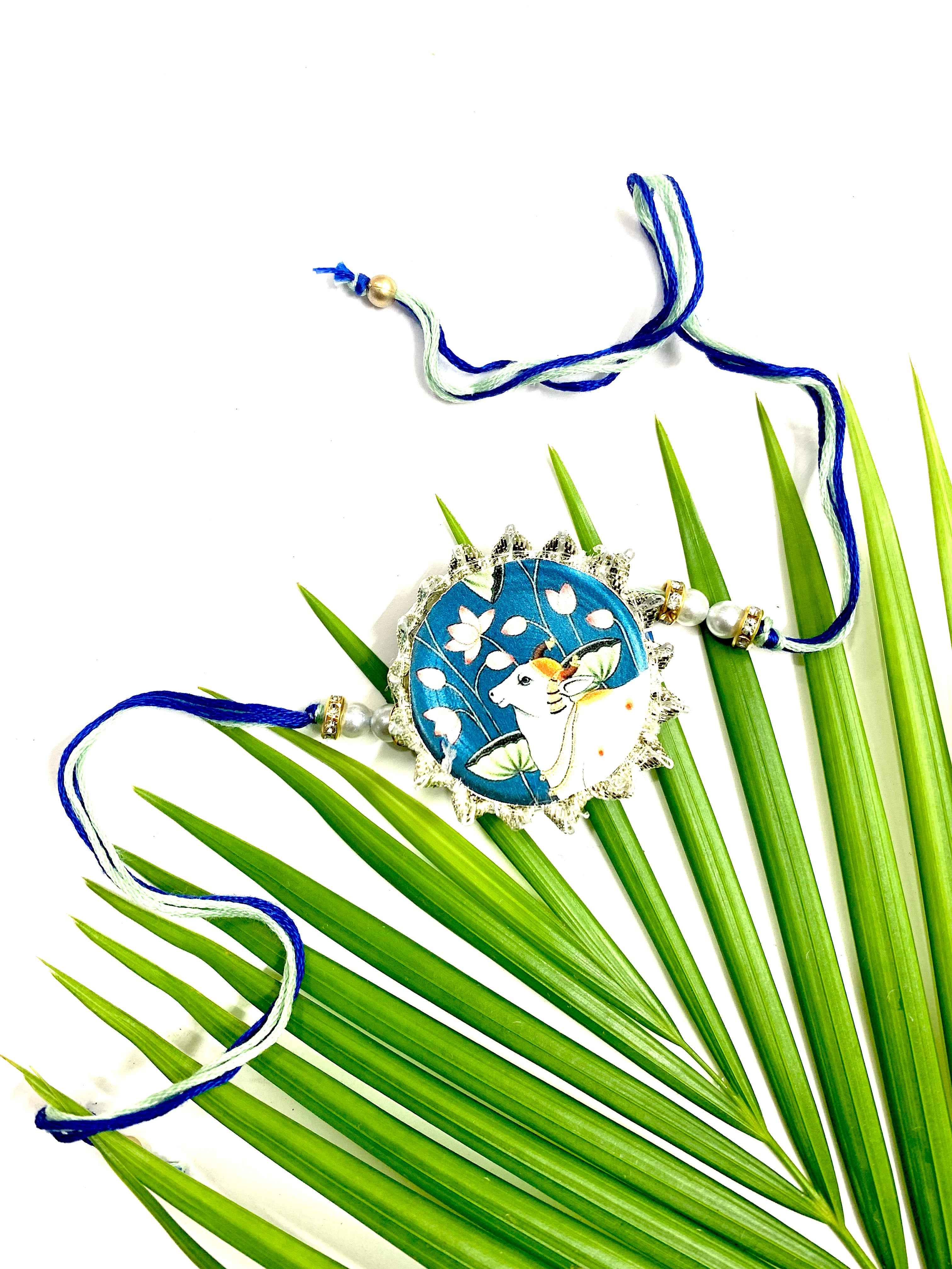 Pichwai Blue Canvas Cow Rakhi