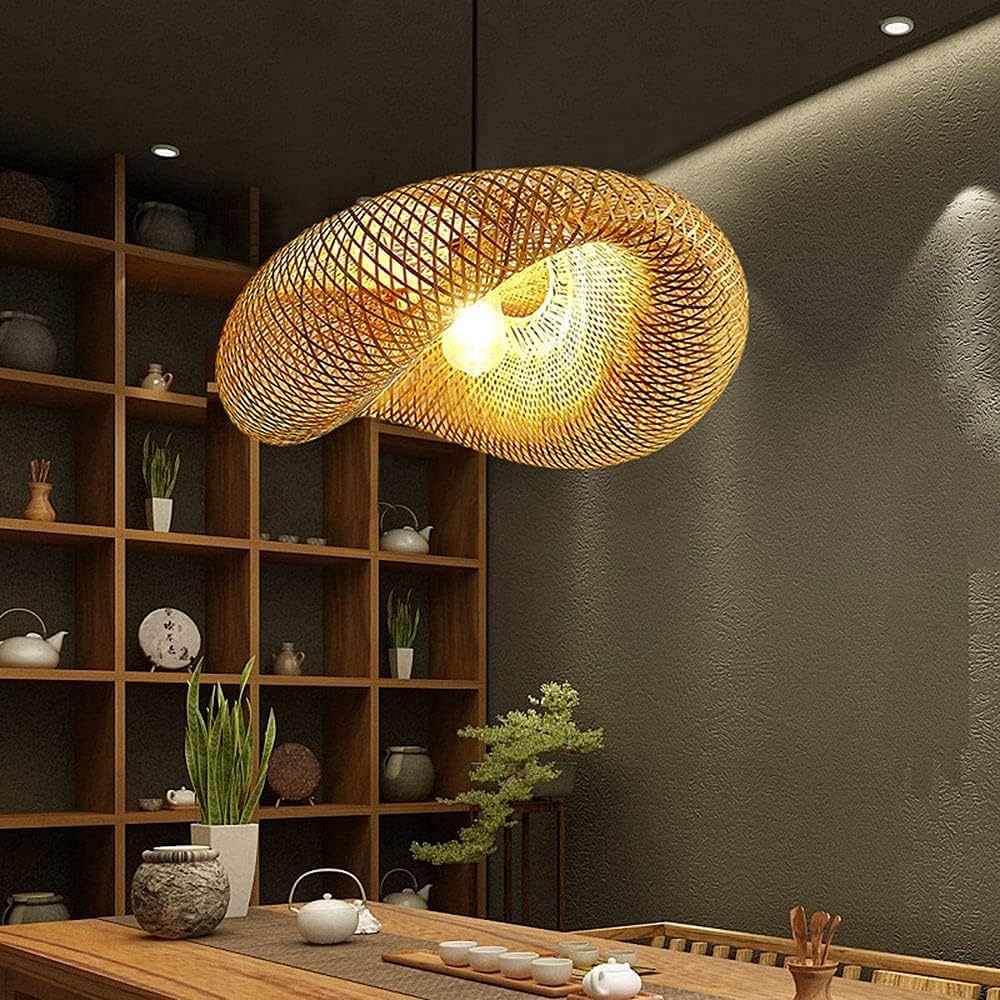 Woven pendant light hanging in a room with wooden shelves and decor items.